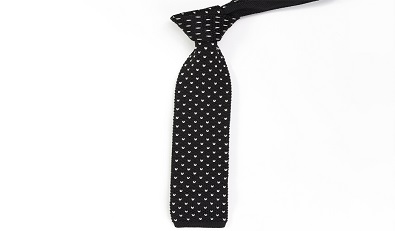 How are handmade ties crafted, and what techniques are used in the process?